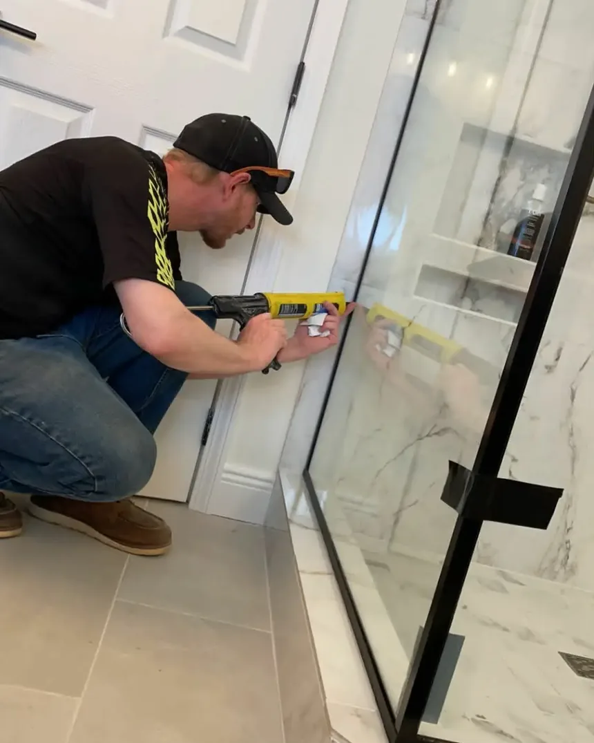 Installing a glass shower enclosure against tiled walls