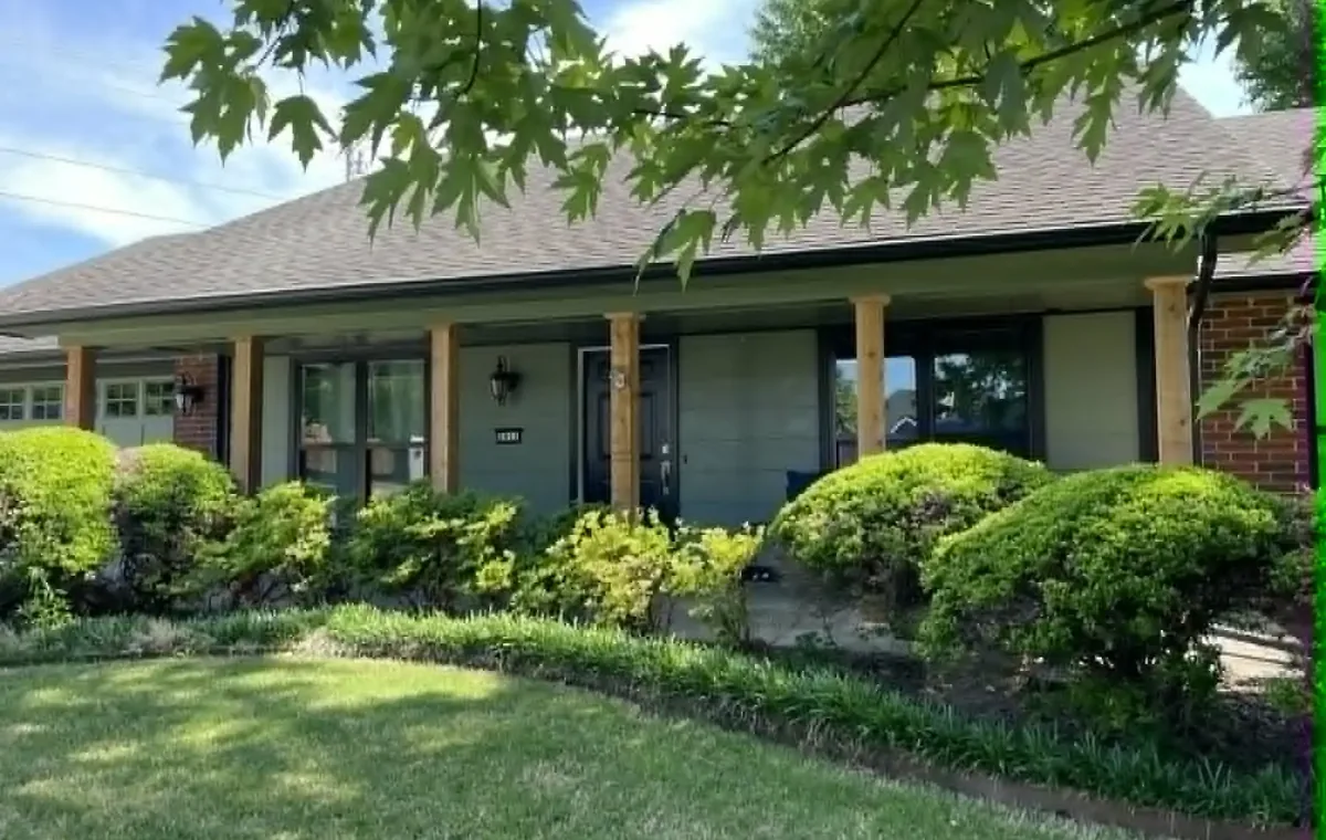 Updated single-story ranch home with fresh exterior paint and new cedar porch posts in Northwest Arkansas